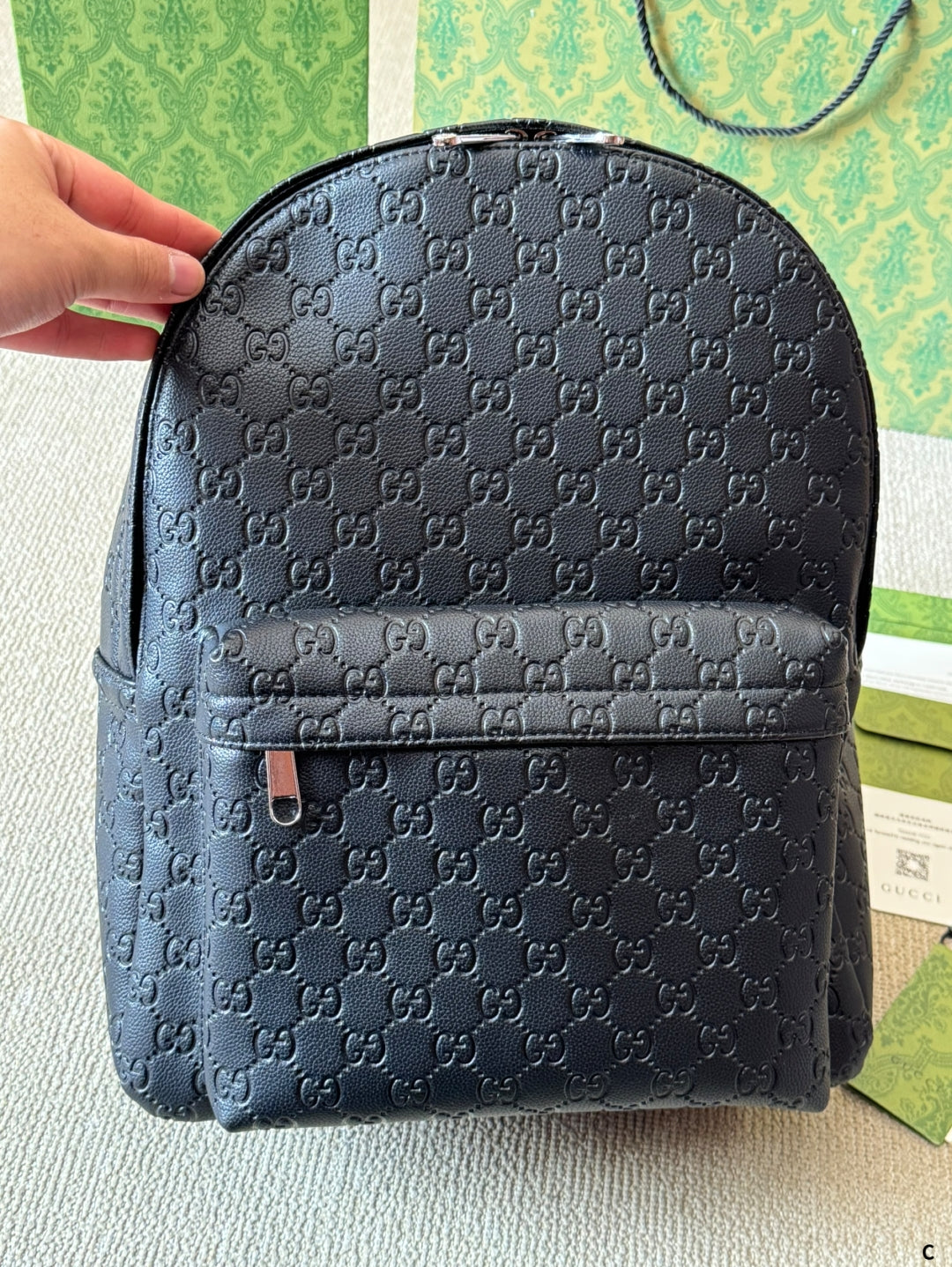 GG Embossed leather backpack 1825052304