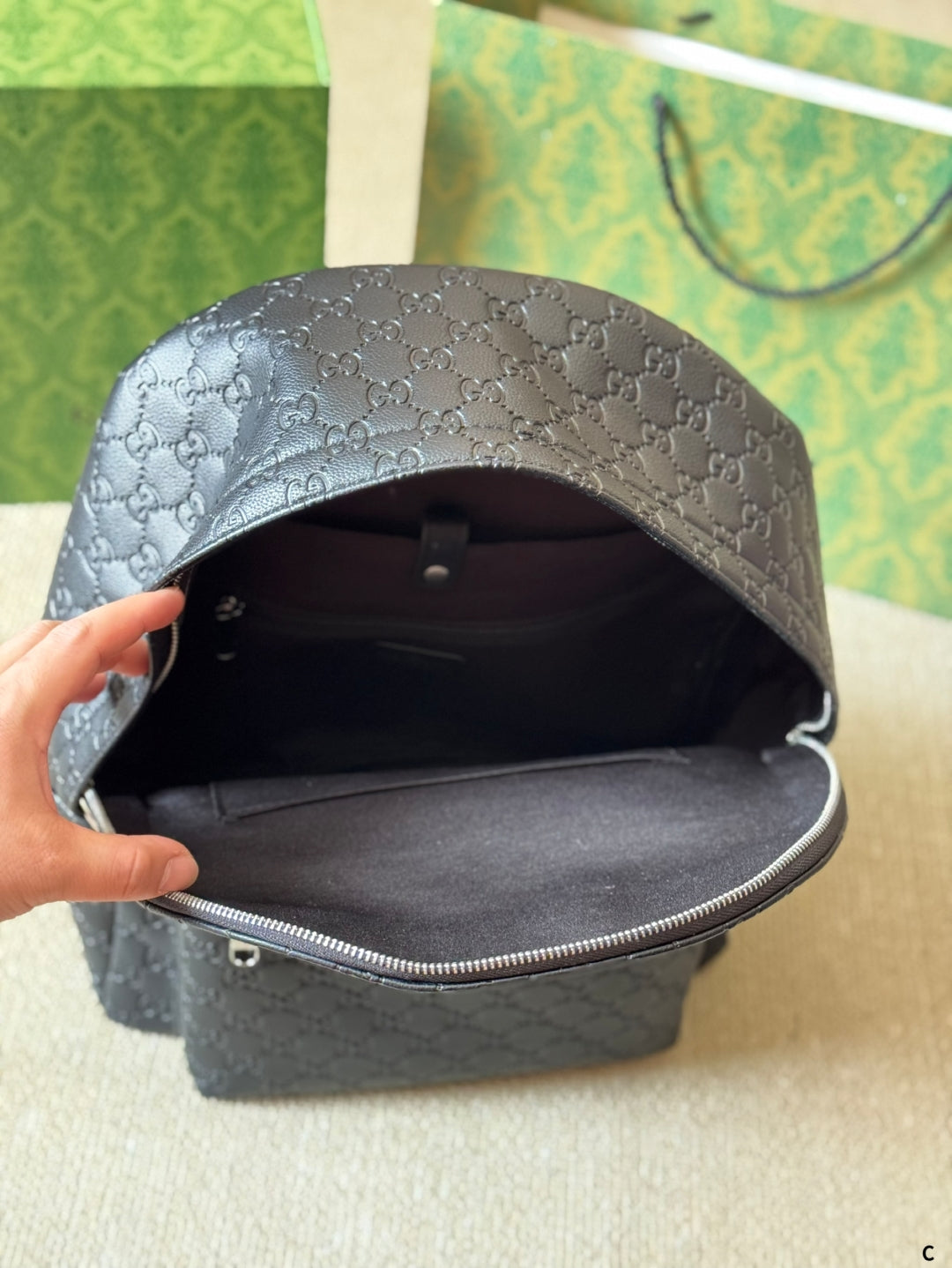 GG Embossed leather backpack 1825052304